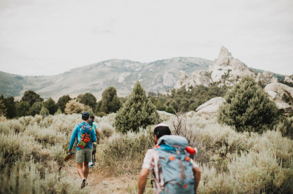 Kevin Jorgeson, Blake Mycoskie, and a guide approach at City of Rocks