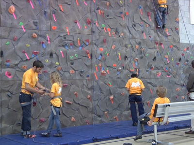 Boys and Girls Club of Sonoma members climb on the new climbing wall in their clubhouse.