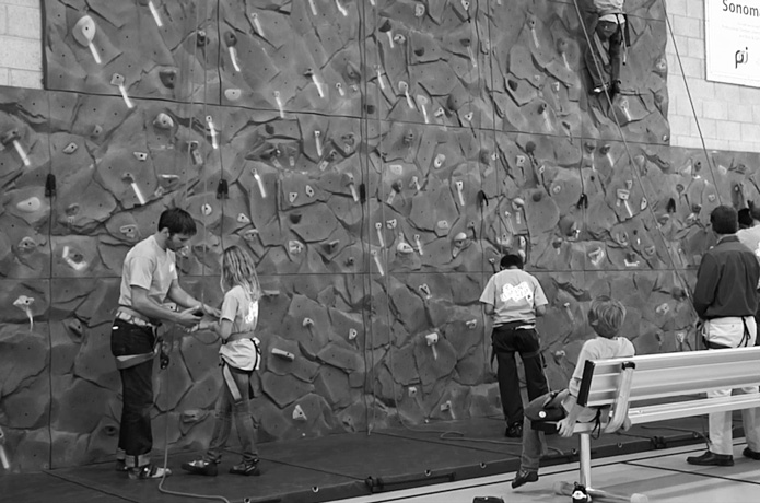 Boys and Girls Club of Sonoma members climb on the new climbing wall in their clubhouse.