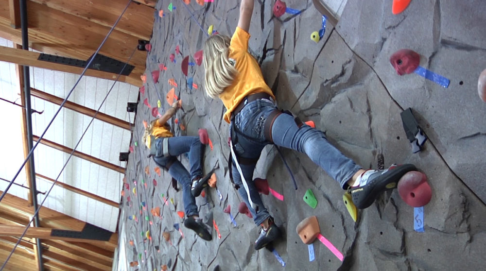 Boys and Girls Club members try climbing for the first time.