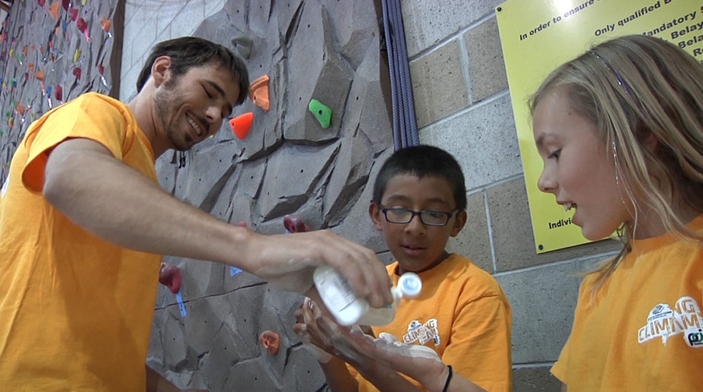 Kevin Jorgeson lets kids try liquid chalk.