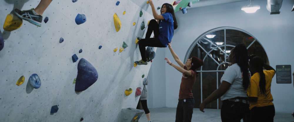 A Chicago Boys and Girls Club member tries climbing for the first time at First Ascent in Chicago.