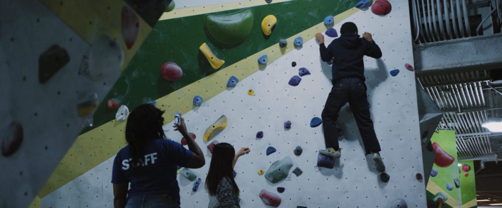 A Chicago Boys and Girls Club member tries climbing for the first time at First Ascent in Chicago.