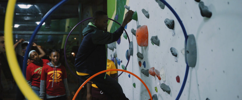 Boys and Girls Clubs members climb through obstacles at First Ascent Climbing Gym.