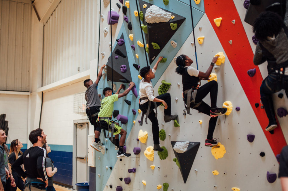 Saint Louis Boys and Girls club members try climbing for the first time.