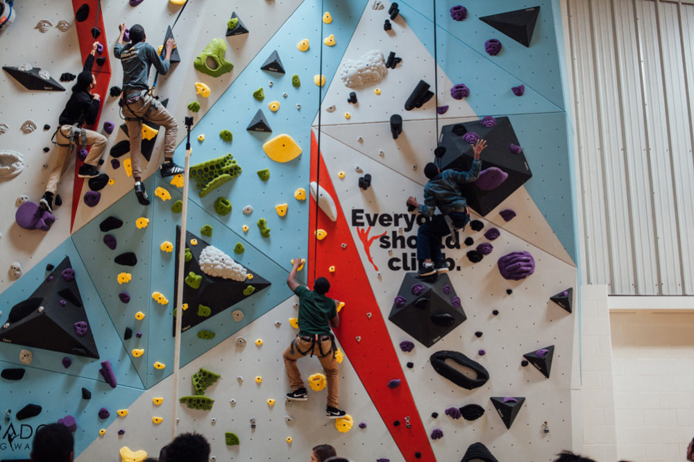 Saint Louis Boys and Girls club members try climbing for the first time on their new climbing wall.