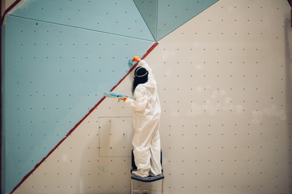 So iLL employee helps paint the wall Saint Louis Boys and Girls club climbing wall.