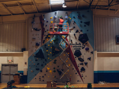 Kevin Jorgeson puts the finishing touches on the Saint Louis Boys and Girls Club climbing wall.