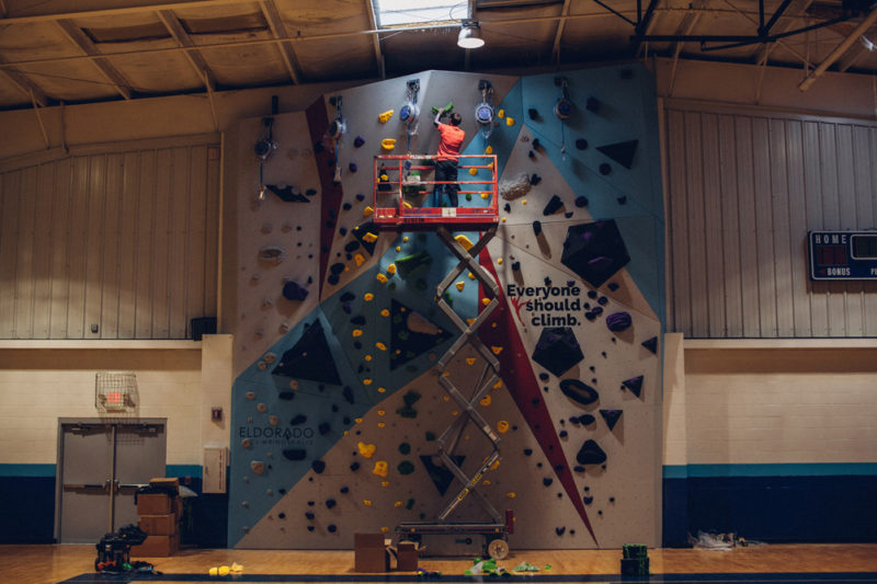 Kevin Jorgeson puts the finishing touches on the Saint Louis Boys and Girls Club climbing wall.