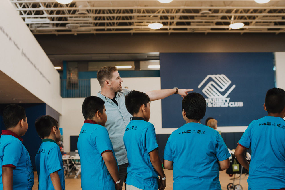 Tim from 1Climb LA Variety Boys and Girls Club points the way for the kids.