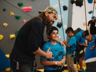 Jason Momoa hangs with a LA Variety Boys and Girls Club member.