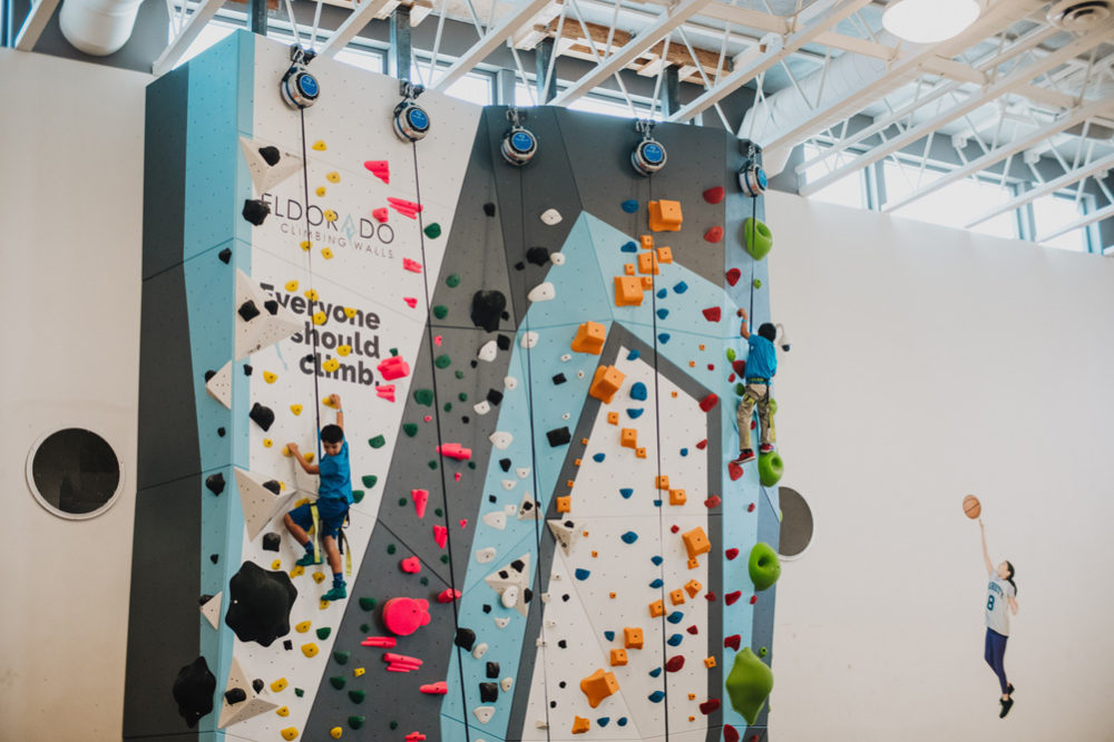 A LA Variety Boys and Girls Club member tries climbing for the first time.