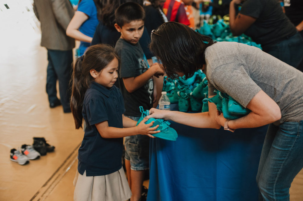 Handing out So iLL shoes at the new L.A. Boys and Girls Club climbing wall opening.