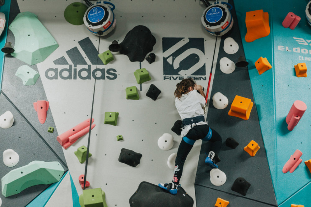 a boys and girls club member climbs up the new 1climb wall in santa rosa