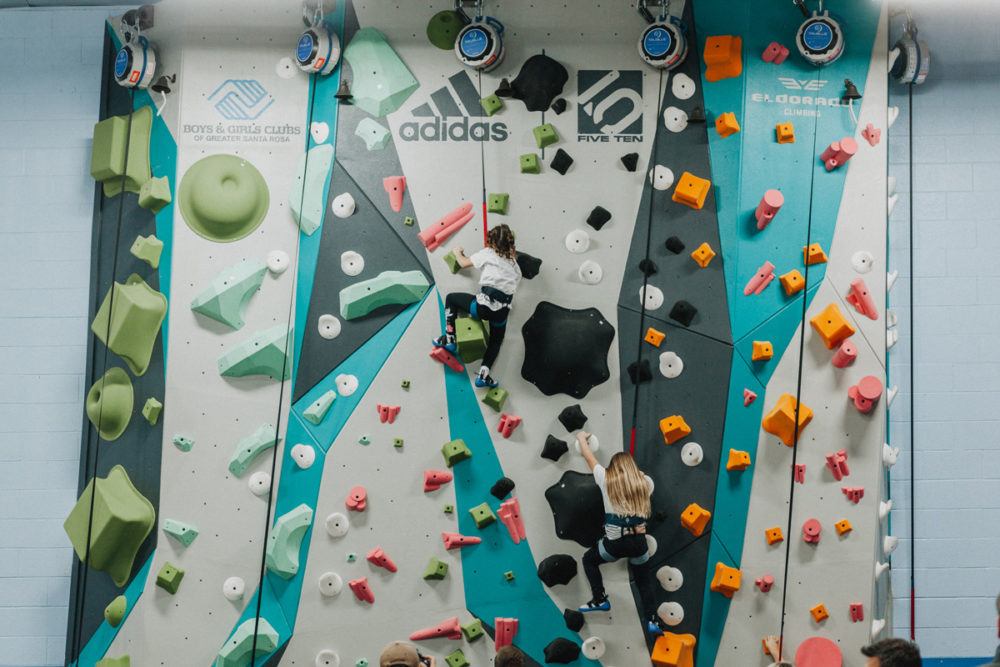 boys and girls club members climb up the new 1climb wall in santa rosa