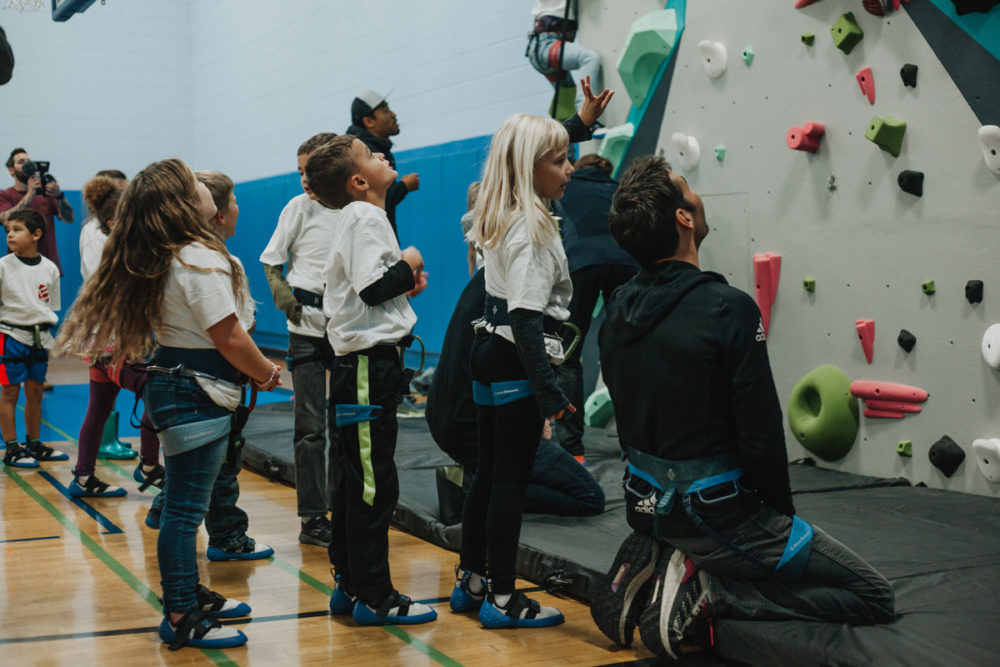 boys and girls club members look up the new 1climb wall in santa rosa