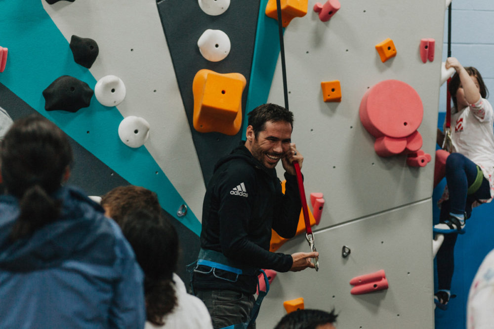 1climb co founder kevin jorgeson pulls an auto belay down to prepare to climb